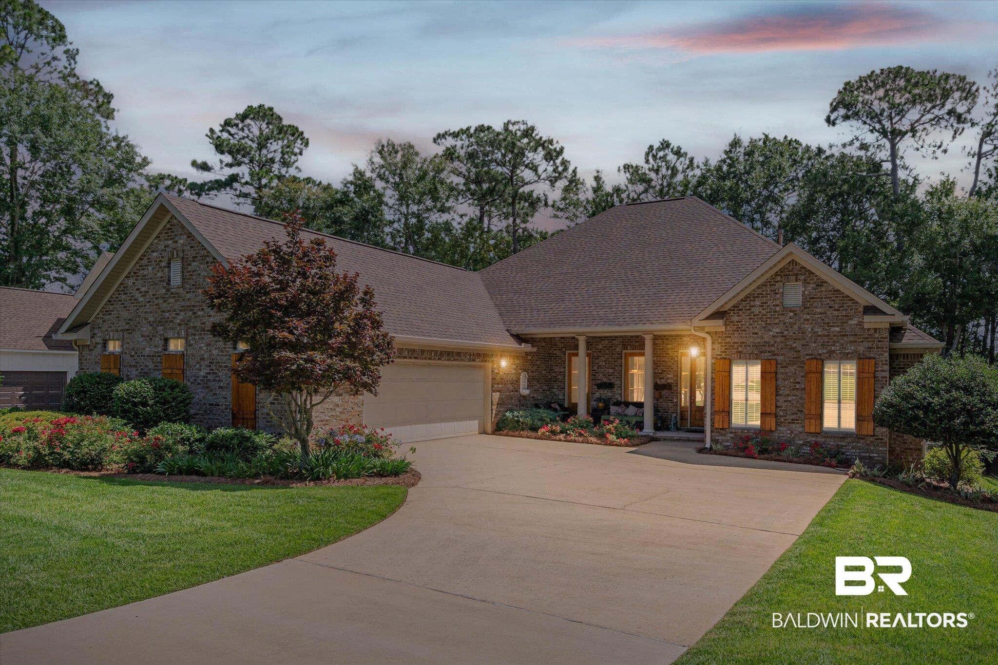Image 2: Stone and brick veneer exterior with a covered entry