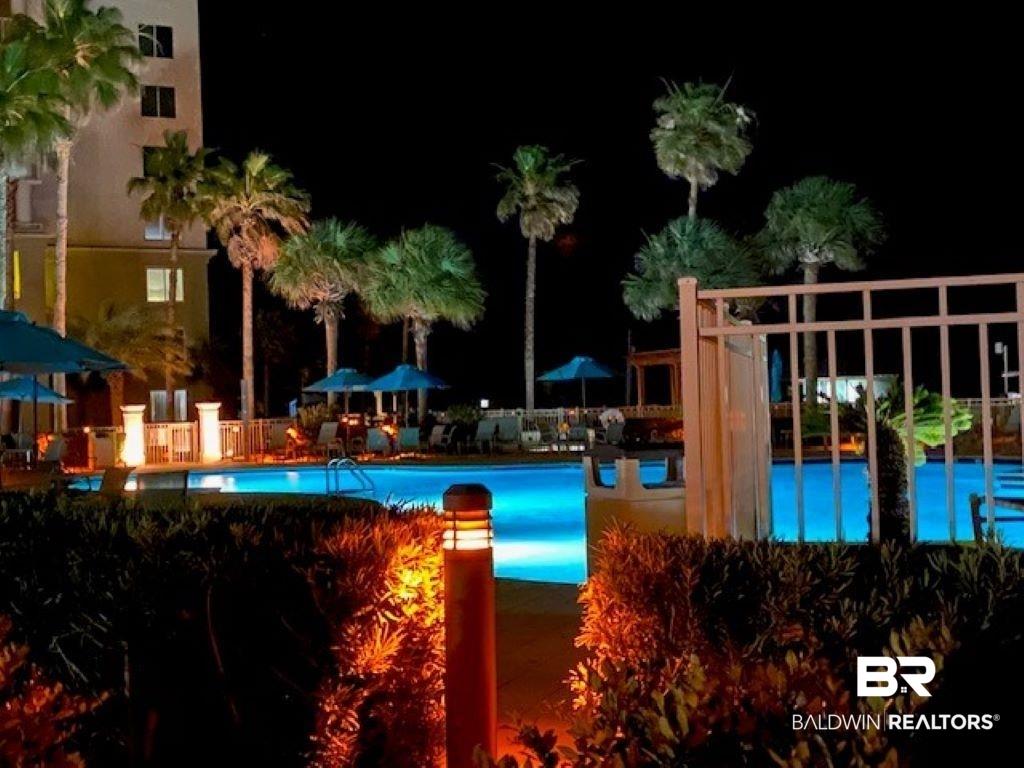Image 4: View of pool at twilight