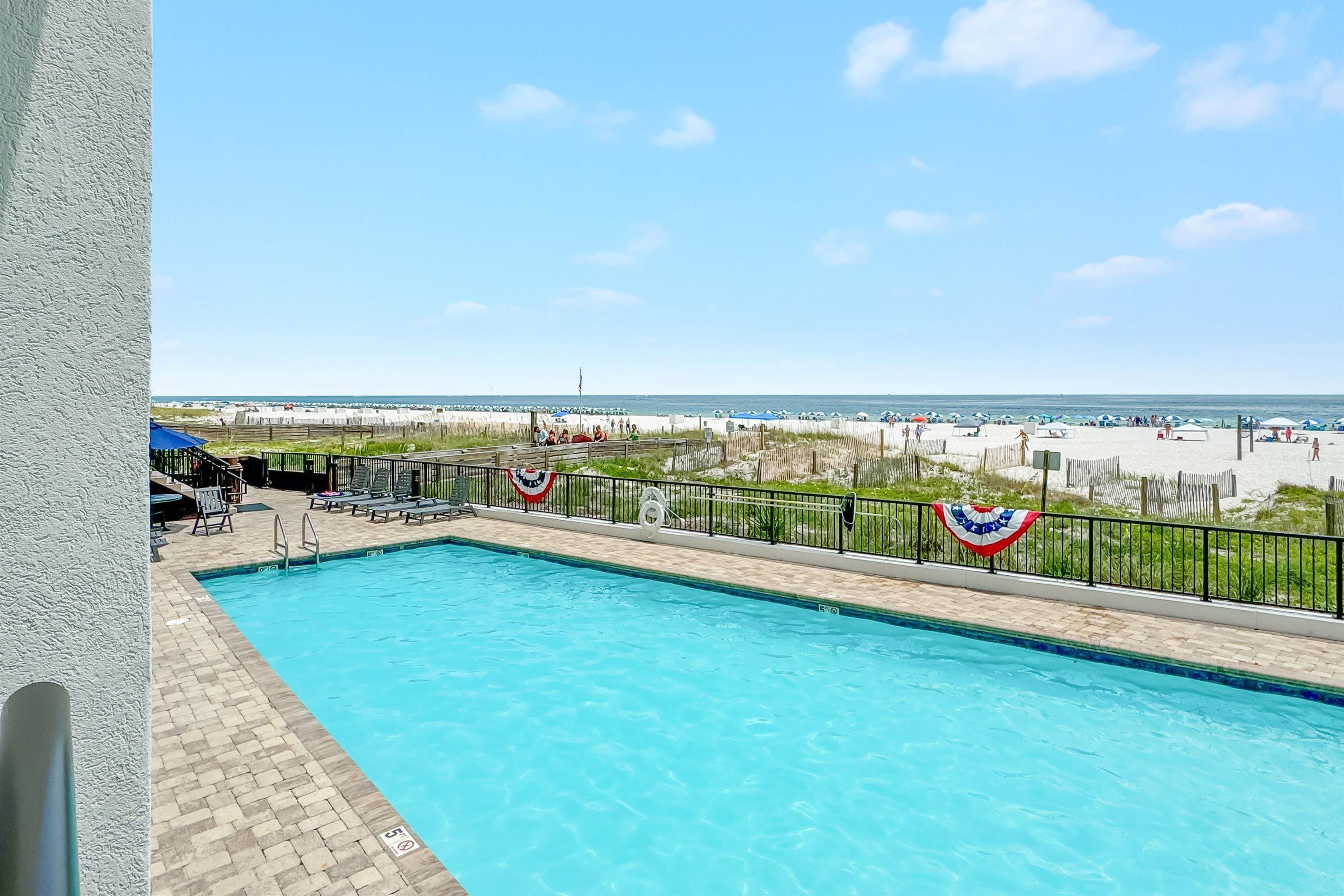 Image 2: View of swimming pool with a water view