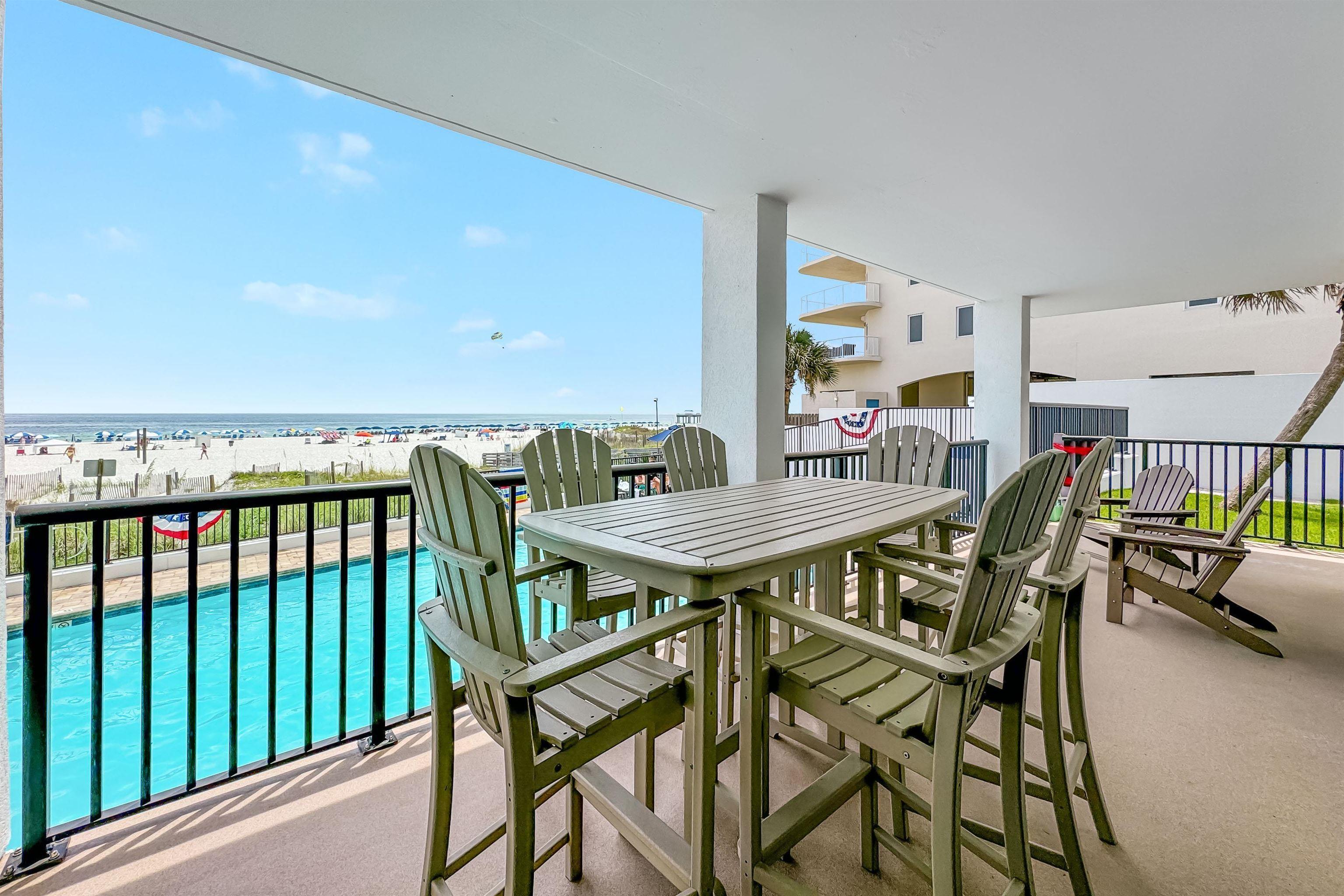Image 4: Balcony featuring a water view and a view of the beach