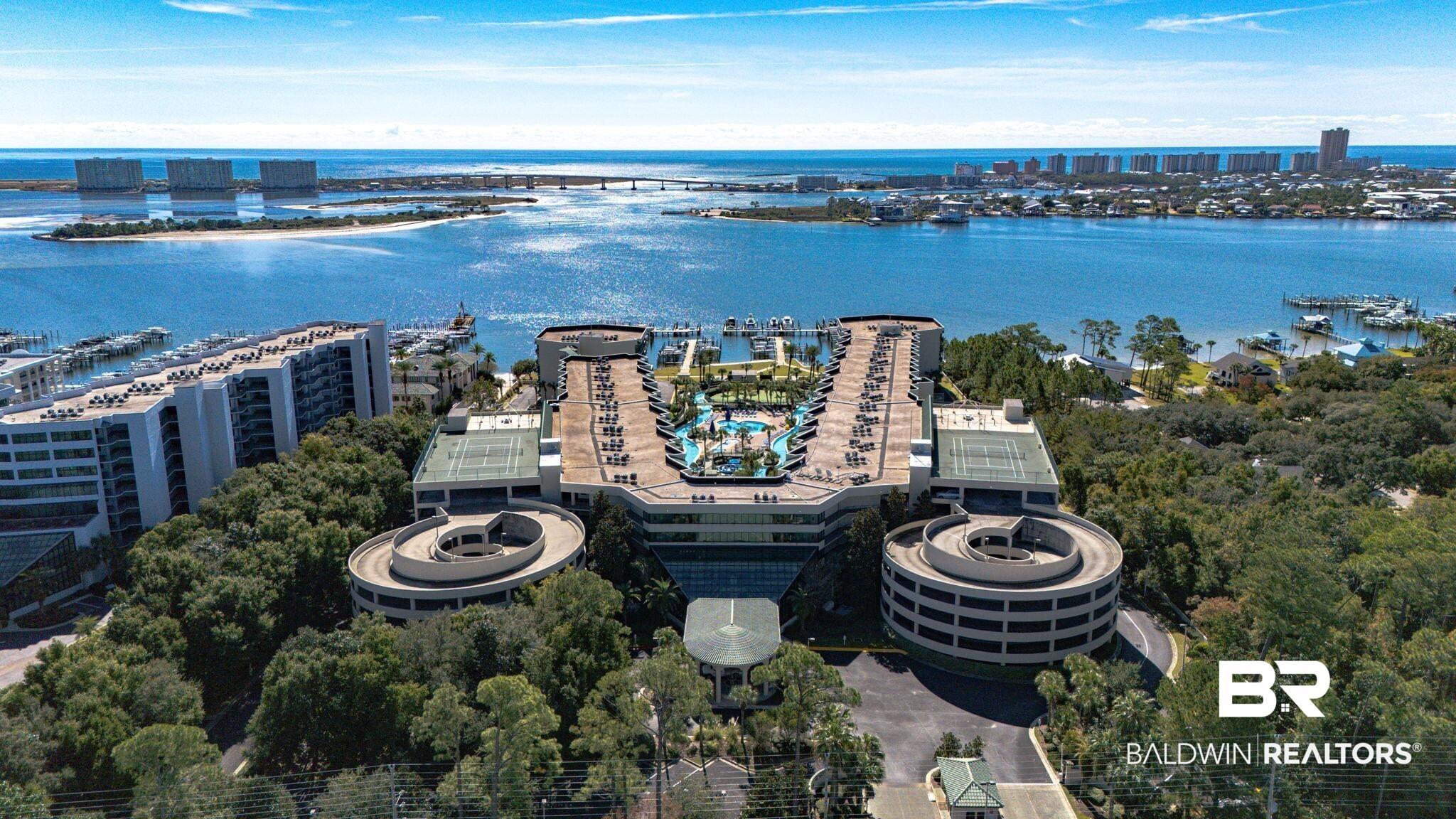 Image 2: View of urban area featuring a nearby body of water and numerous boat docks