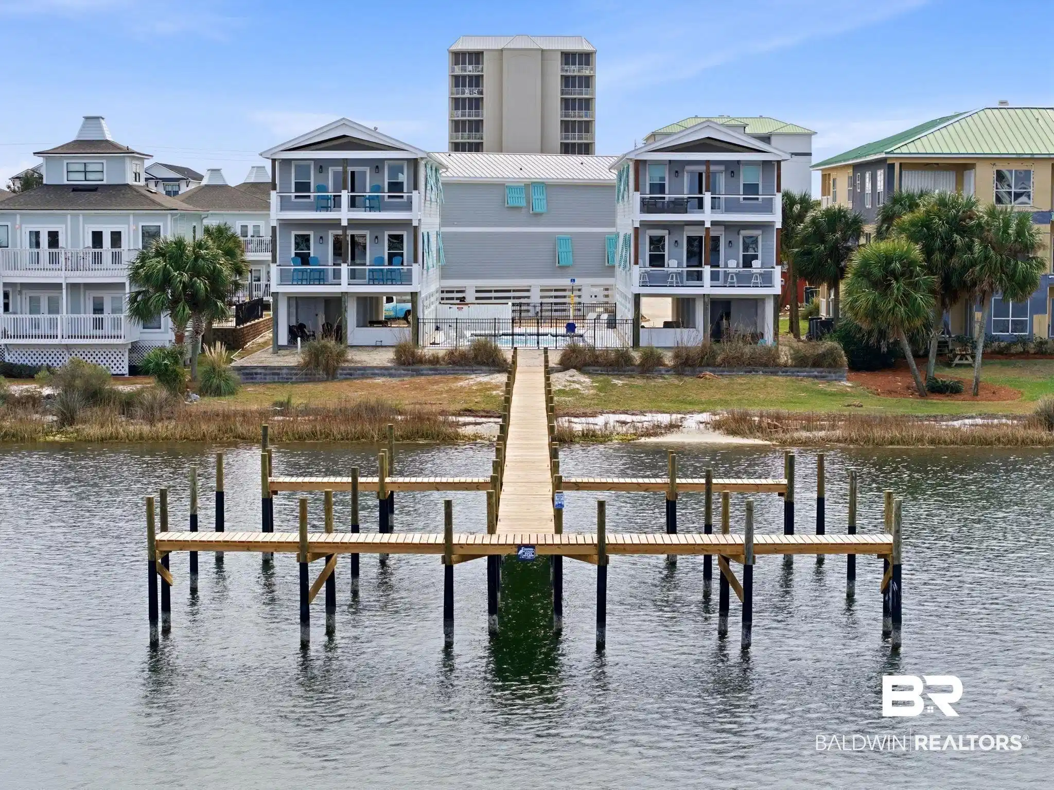 Image 1: Dock featuring a water view