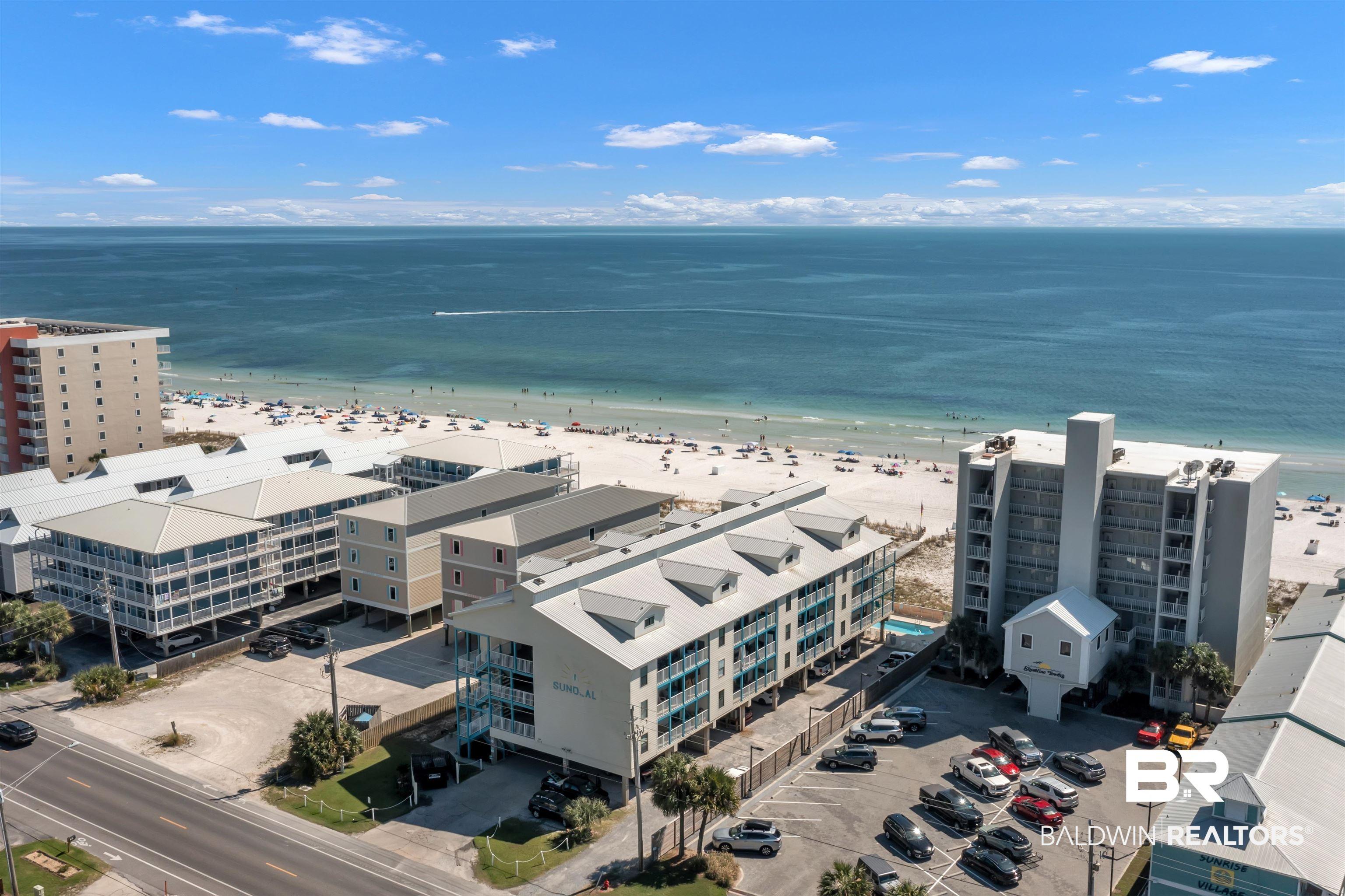 Image 3: Coastal property showcasing direct beach access and expansive water frontage