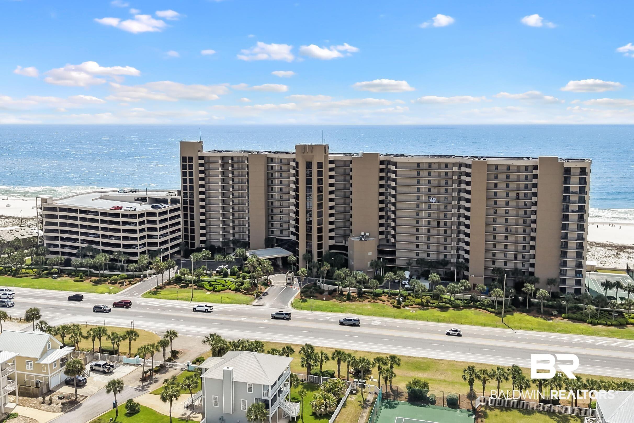Image 1: Aerial view of apartment complex / building and a large body of water