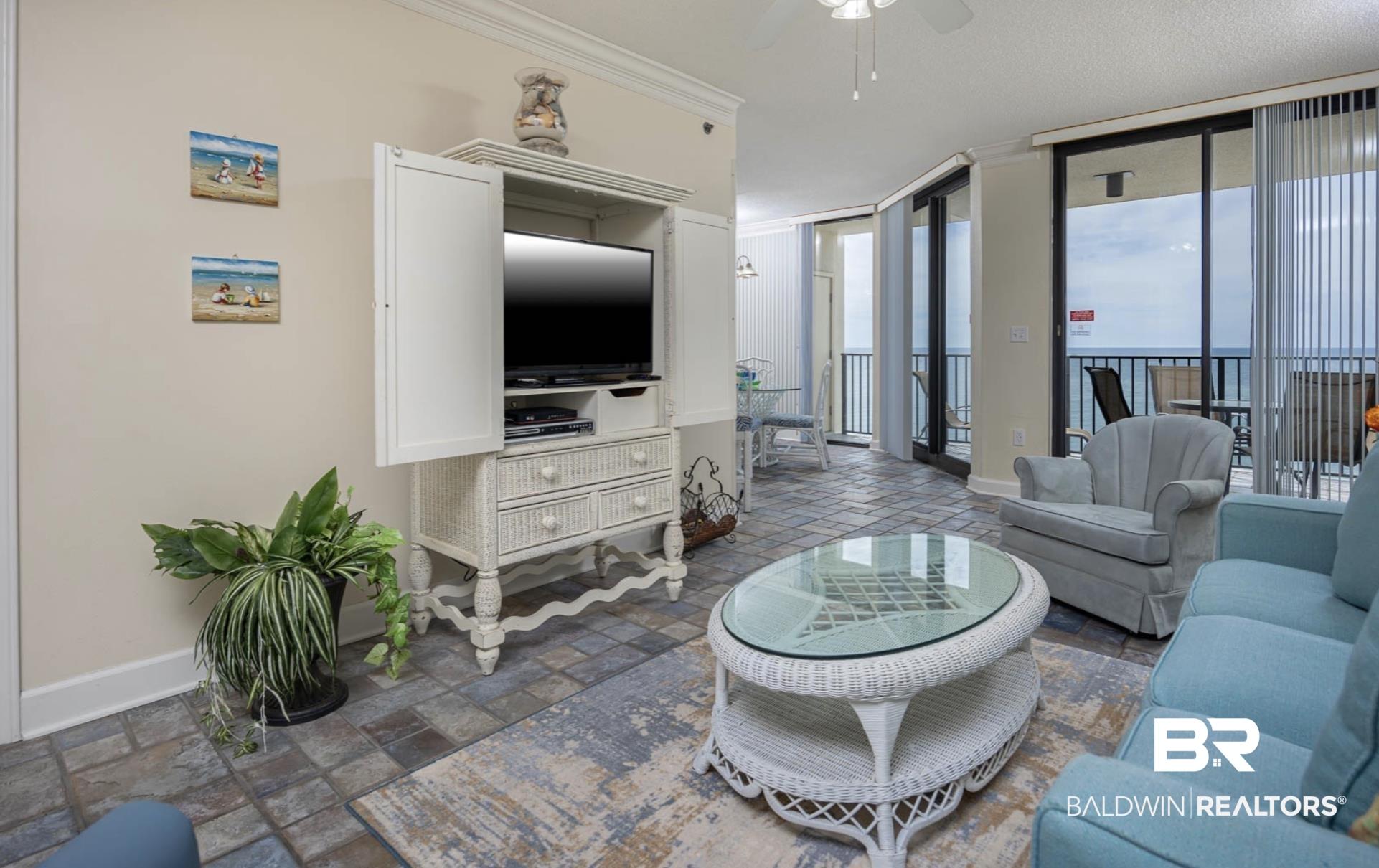 Image 3: Living room featuring ornamental molding and ceiling fan