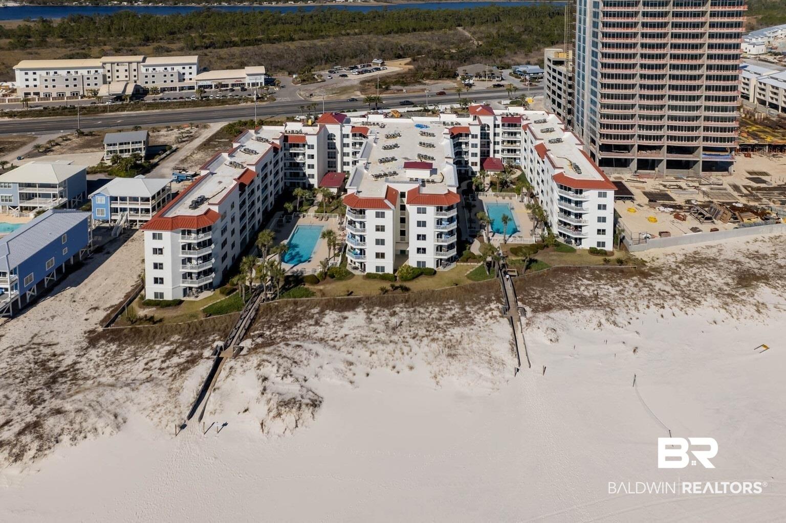 Image 2: Aerial view of apartment complex / building and a pool