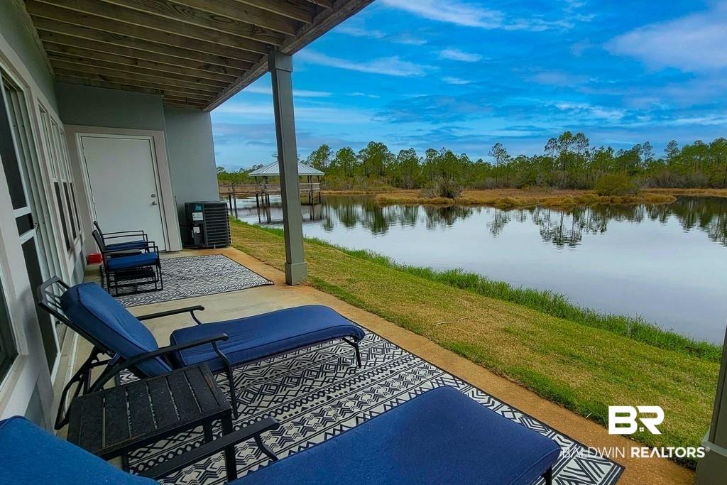 Image 3: View of patio featuring a water view