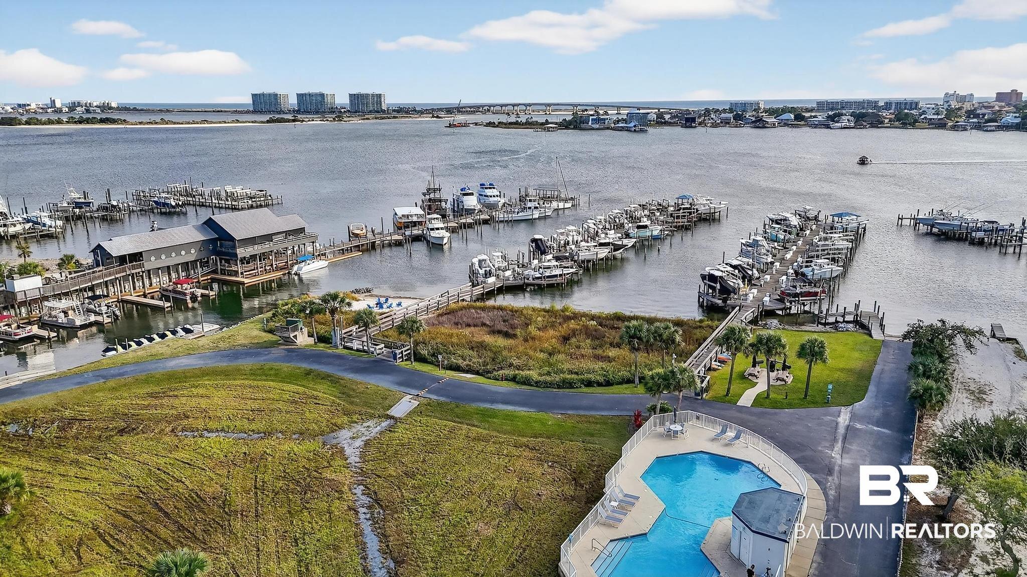 Image 3: Bird's eye view of a marina and a large body of water