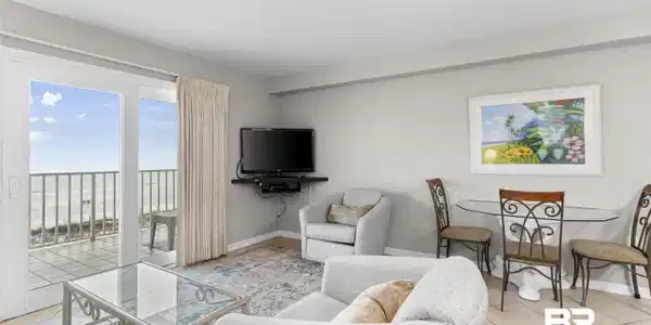 Image 2: Tiled living room featuring baseboards
