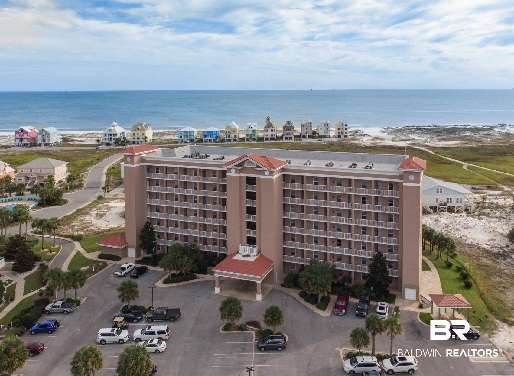 Image 3: Bird's eye view of apartment complex / building and unending shoreline