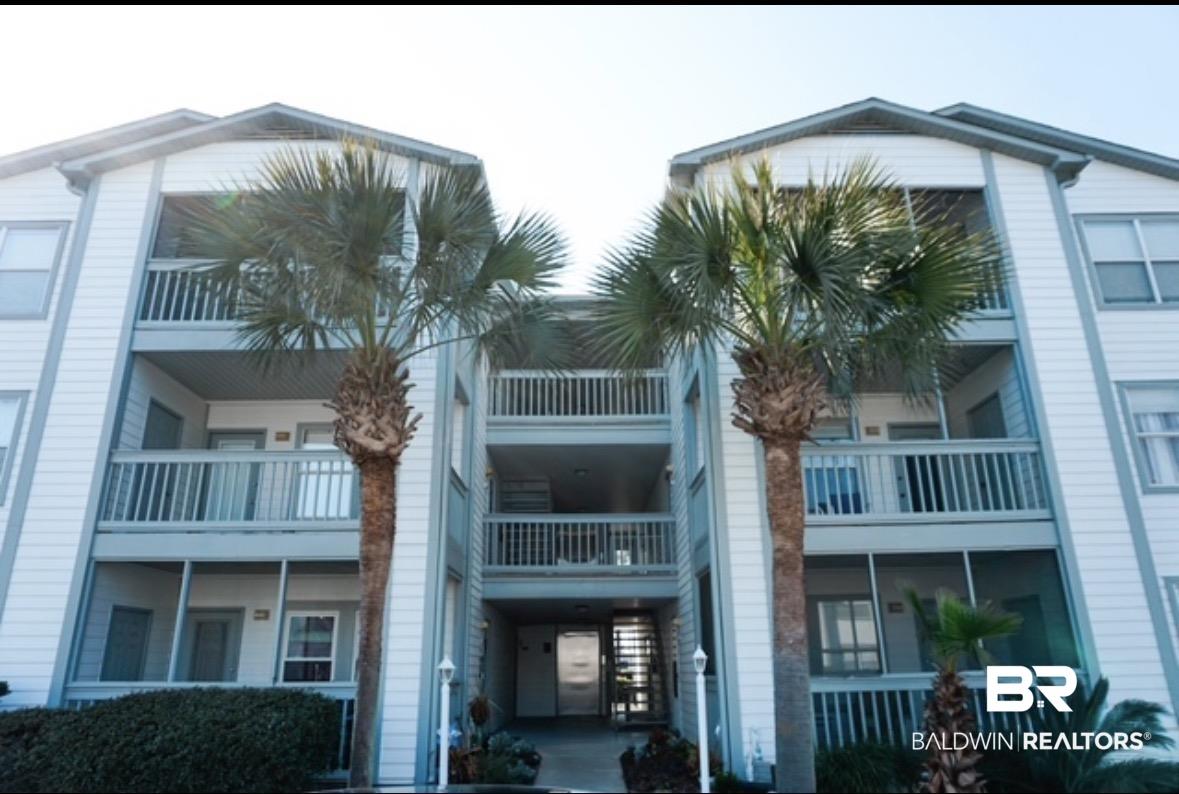 Image 1: View of apartment building / complex