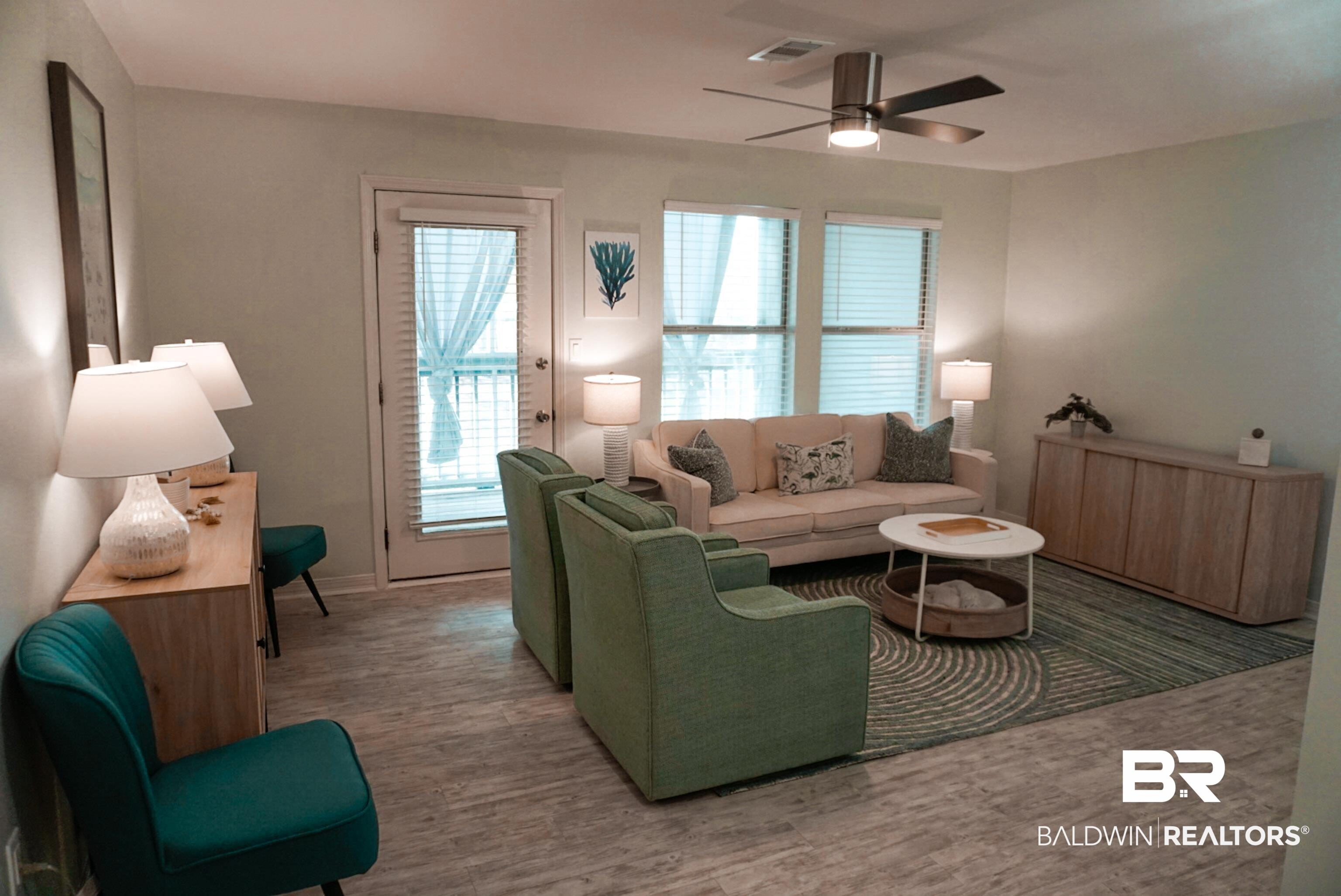 Image 2: Living area featuring ceiling fan and wood finished floors