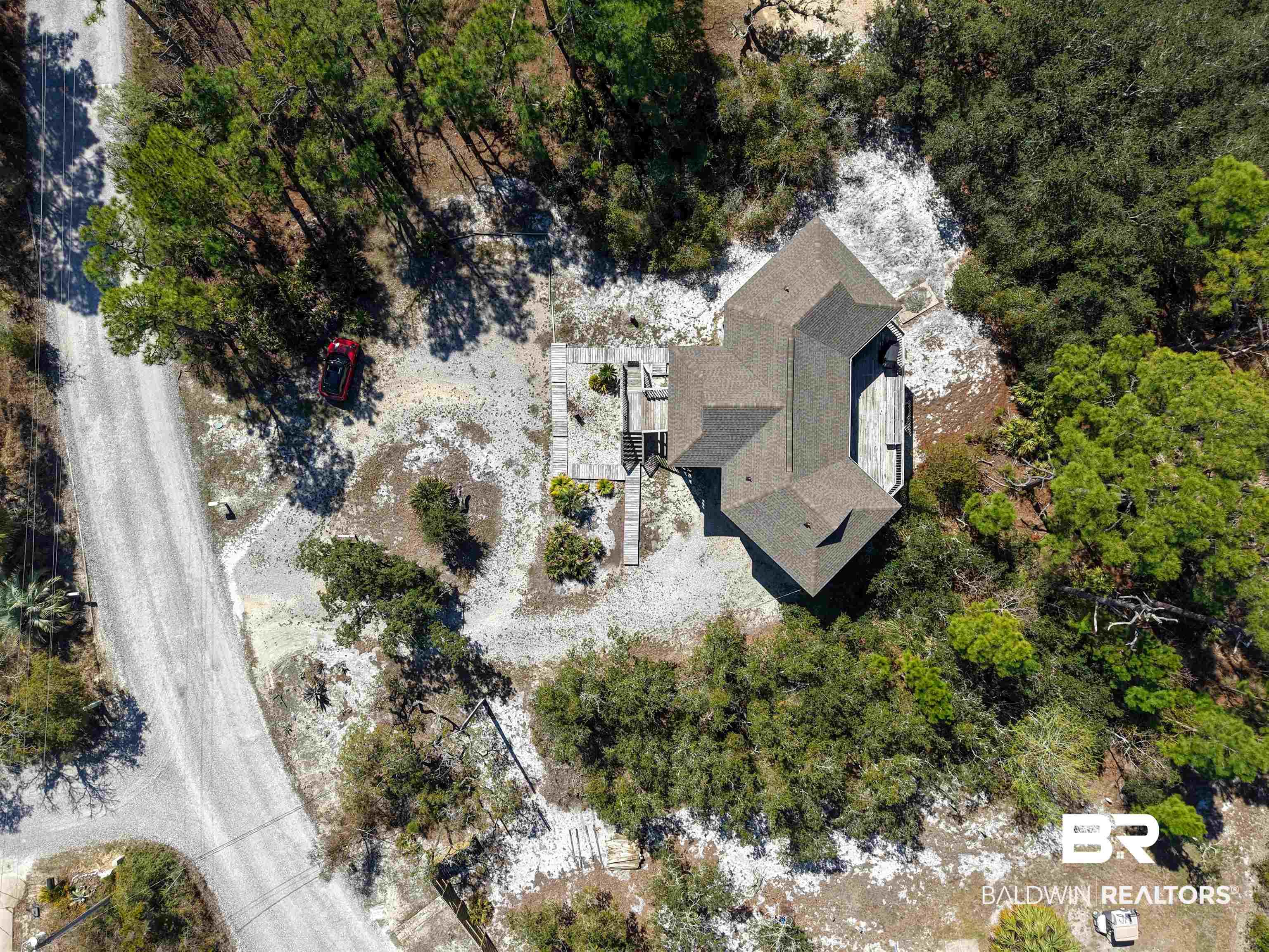 Image 3: Aerial view of property and surrounding area with a tree filled landscape
