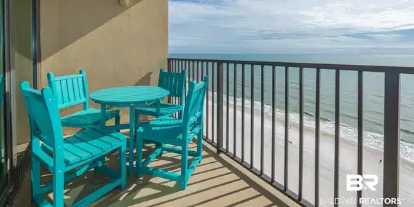 Image 2: Balcony with view of water and beach