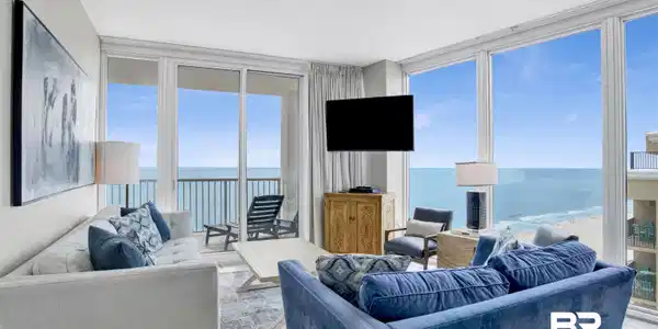 Image 3: Living room with floor to ceiling windows and tile patterned floors