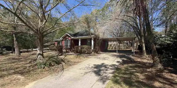 Image 4: Ranch-style home with driveway and a carport