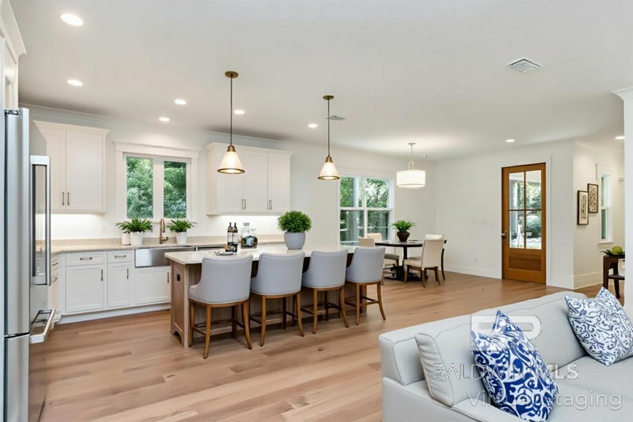 Image 4: Virtually staged kitchen/den