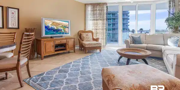Image 2: Living room featuring a wall of windows, ceiling fan, and light tile patterned floors