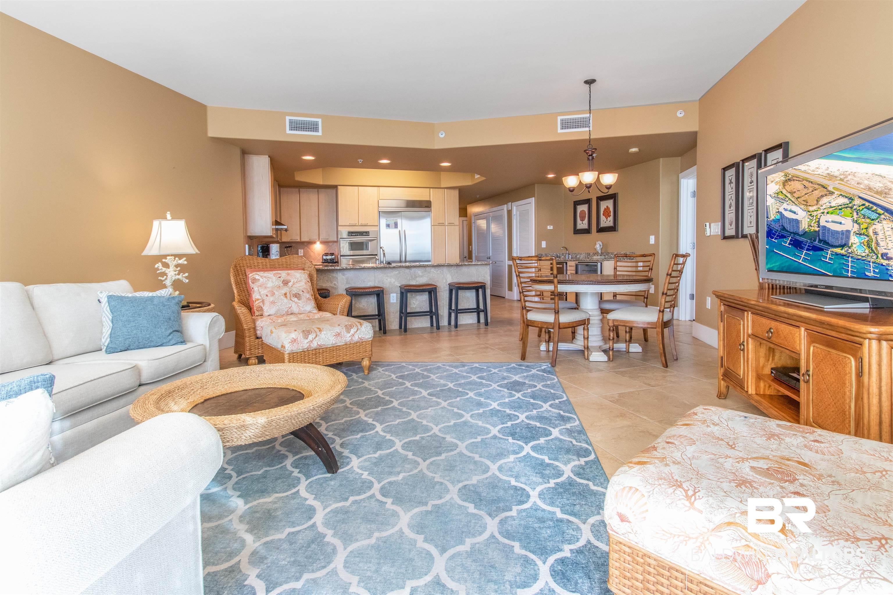 Image 3: Living room featuring a chandelier, recessed lighting, and light tile patterned flooring