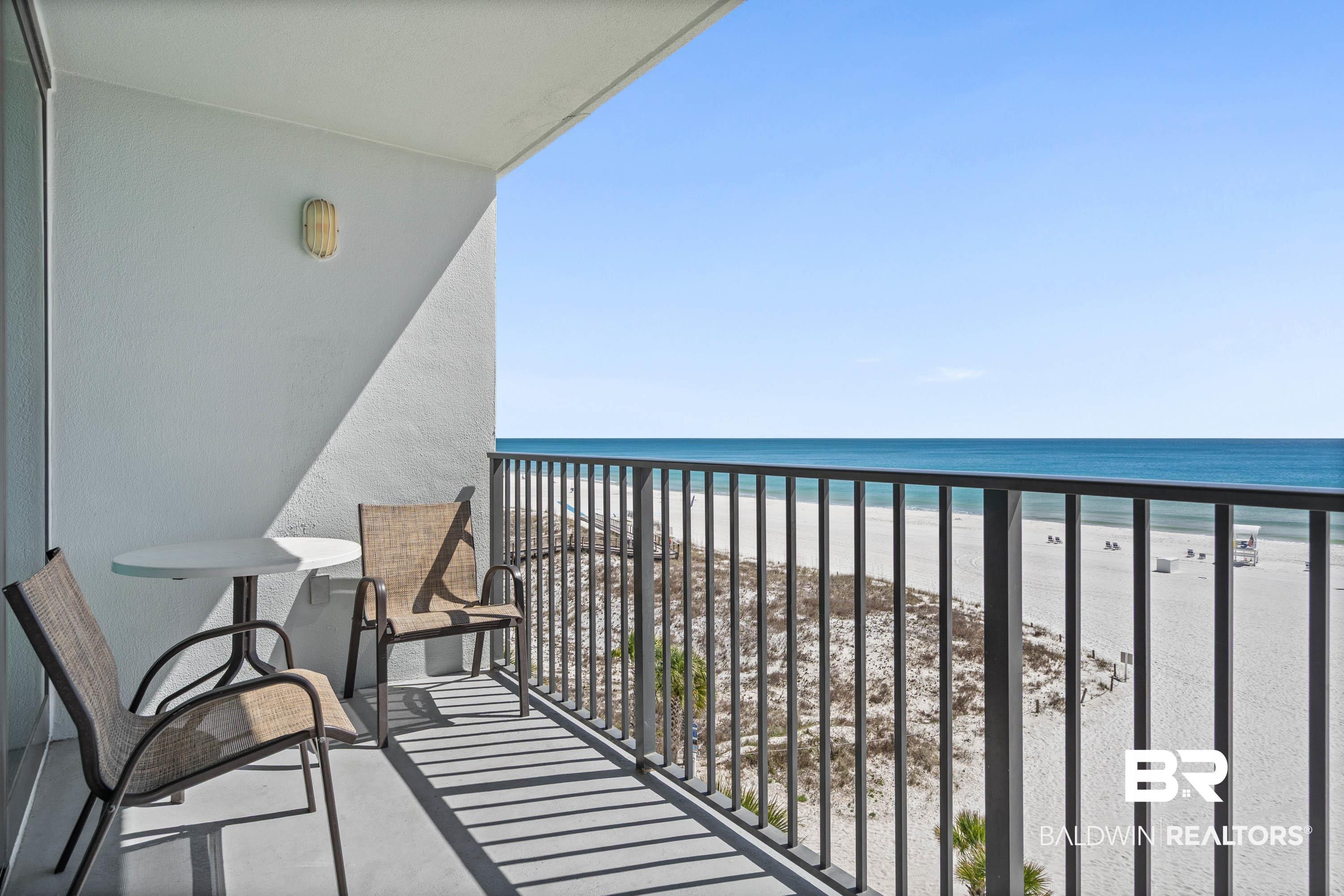 Image 2: Balcony with view of water and beach