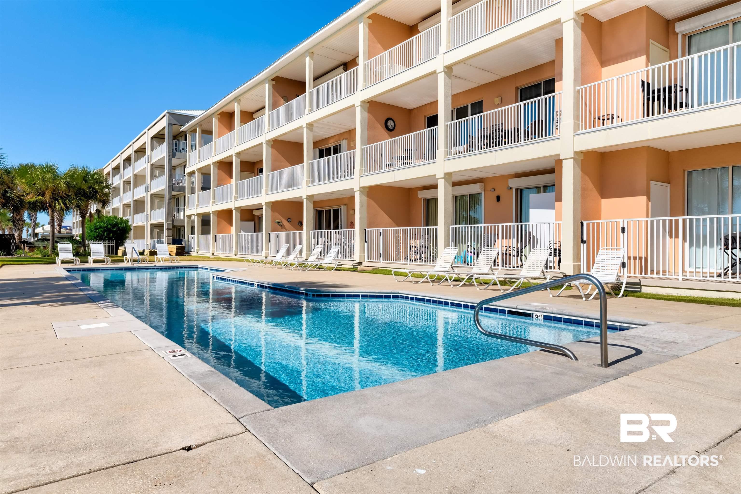Image 2: View of pool featuring a patio area
