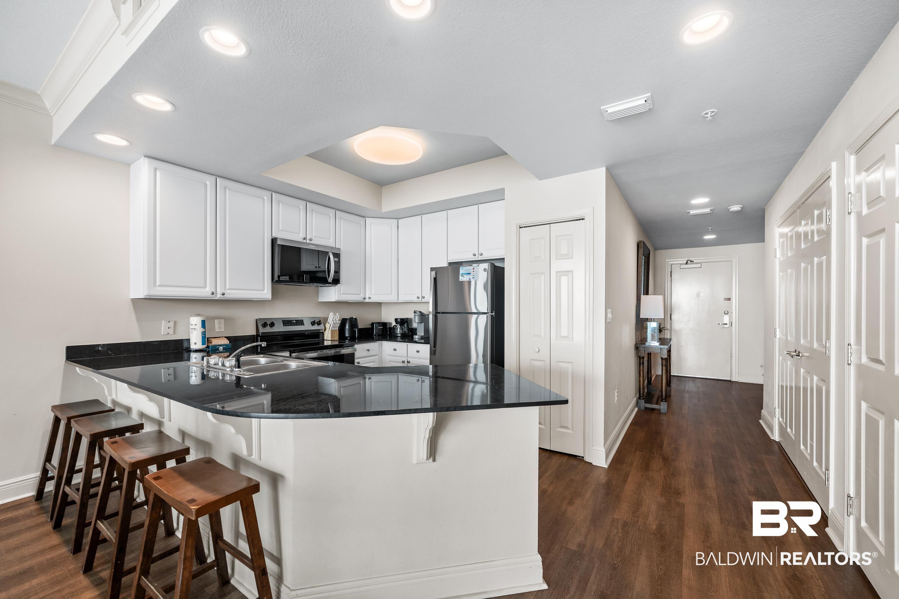 Image 4: Kitchen to Front Door and 2nd Bedroom
