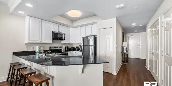 Image 4: Kitchen to Front Door and 2nd Bedroom