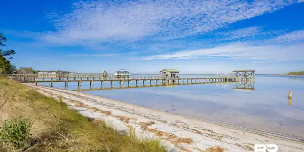 Image 3: Dock featuring a water view and a pier