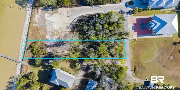 Image 4: Aerial view of property's location featuring property parcel outlined