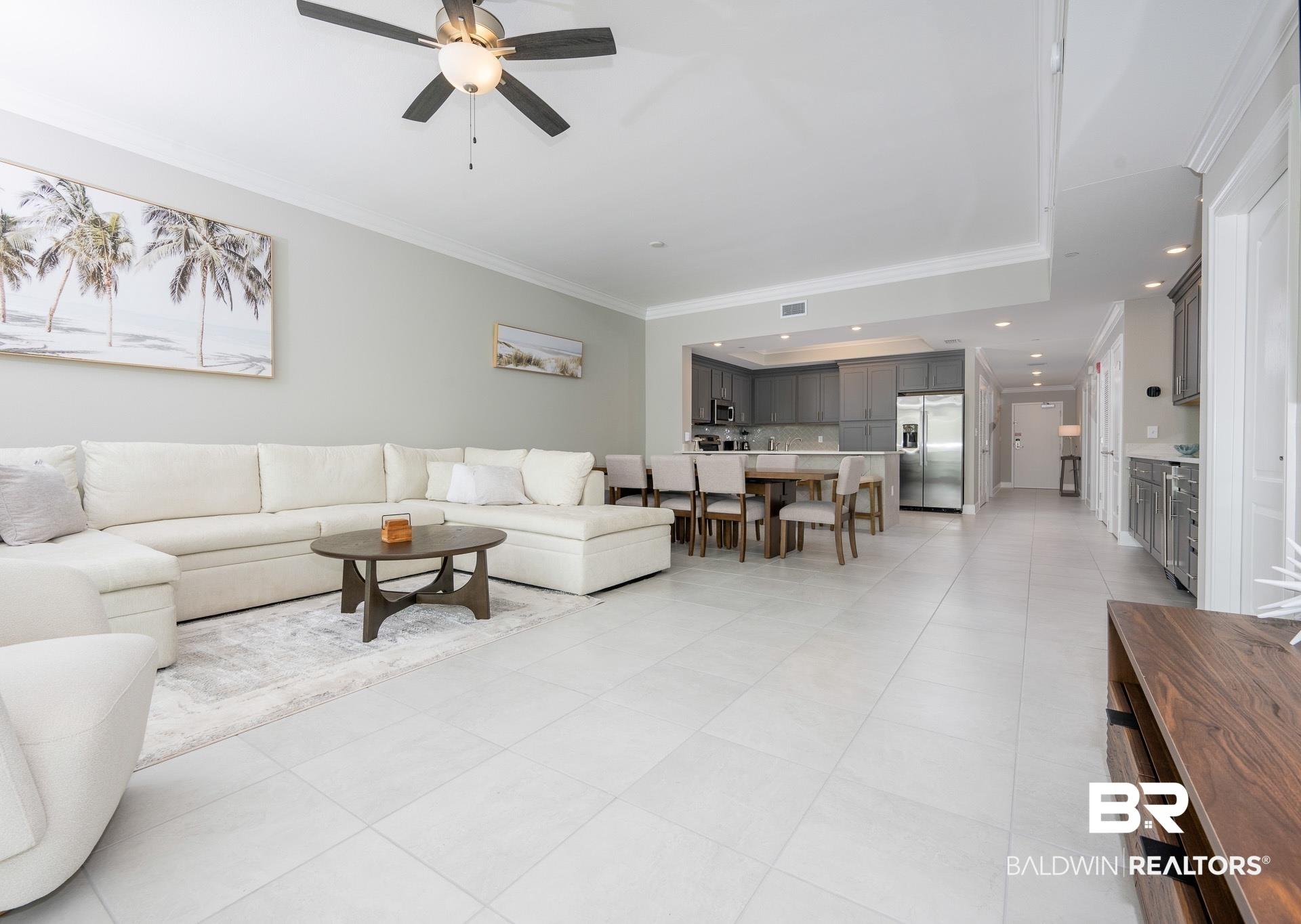Image 3: Living room featuring ornamental molding, recessed lighting, light tile patterned floors, and a ceiling fan