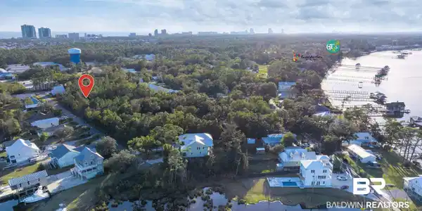 Image 4: Aerial view of property and surrounding area featuring nearby suburban area and skyline