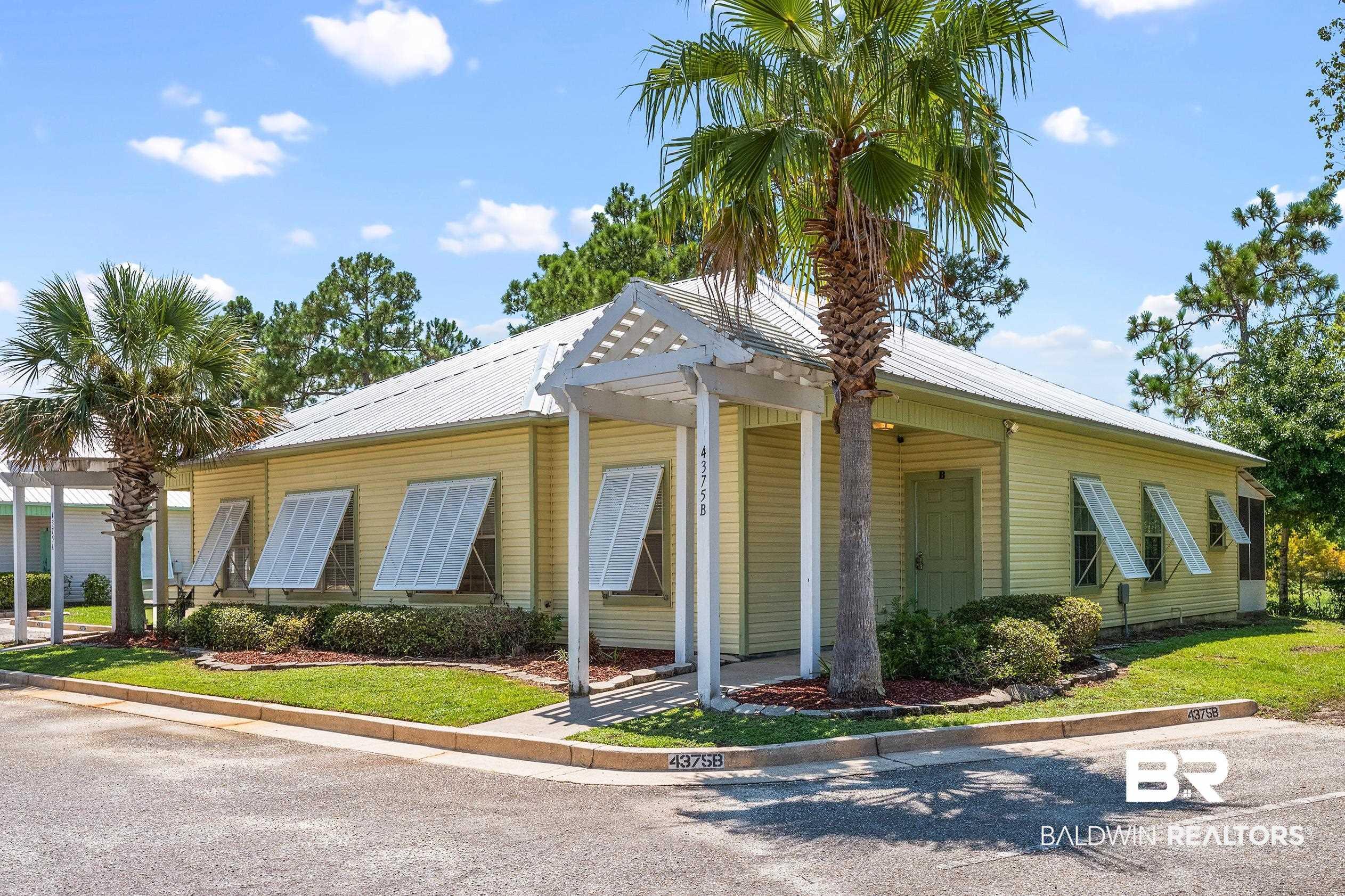 Image 1: Bungalow-style house featuring a metal roof