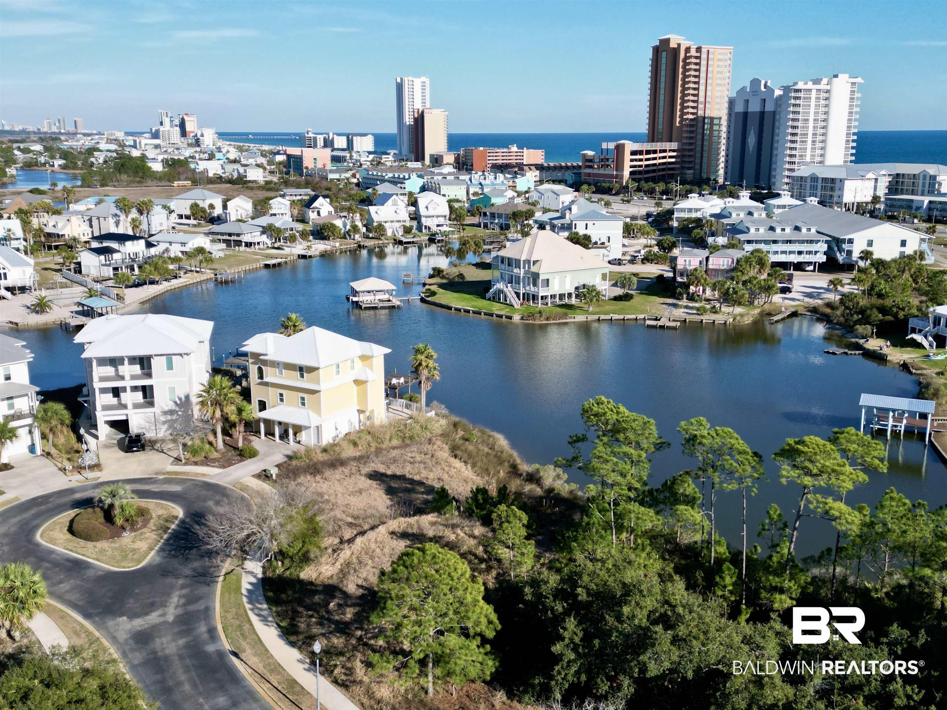 Image 3: View of urban area featuring a large body of water