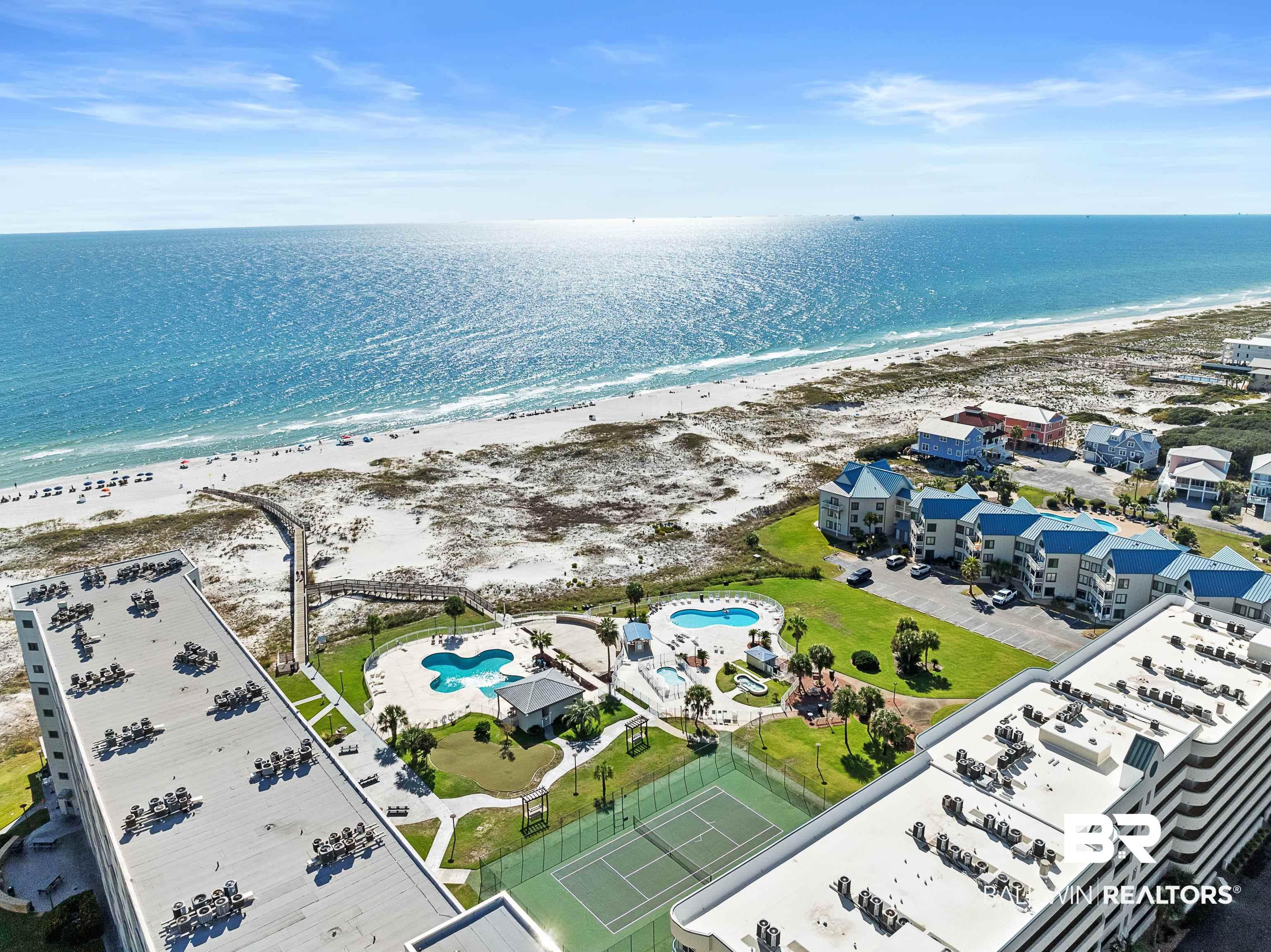 Image 2: Bird's eye view of a pool and unending shoreline