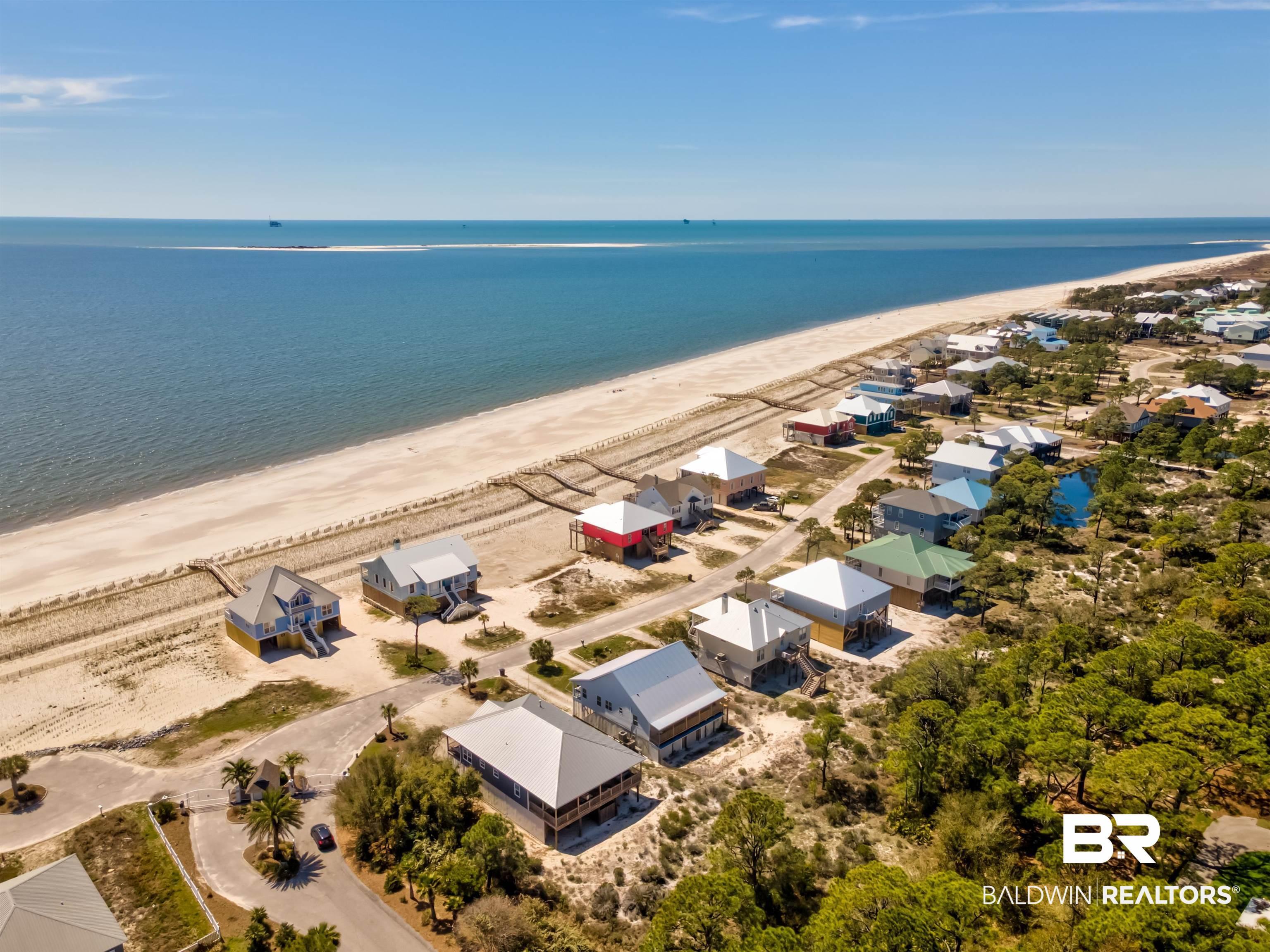 Image 2: Aerial view of residential area with unending shoreline