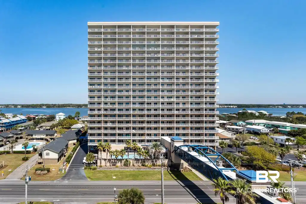 Image 1: View of building exterior featuring a water view