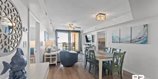 Image 4: Dining area with a textured ceiling, dark wood-type flooring, a ceiling fan, and a wall of windows