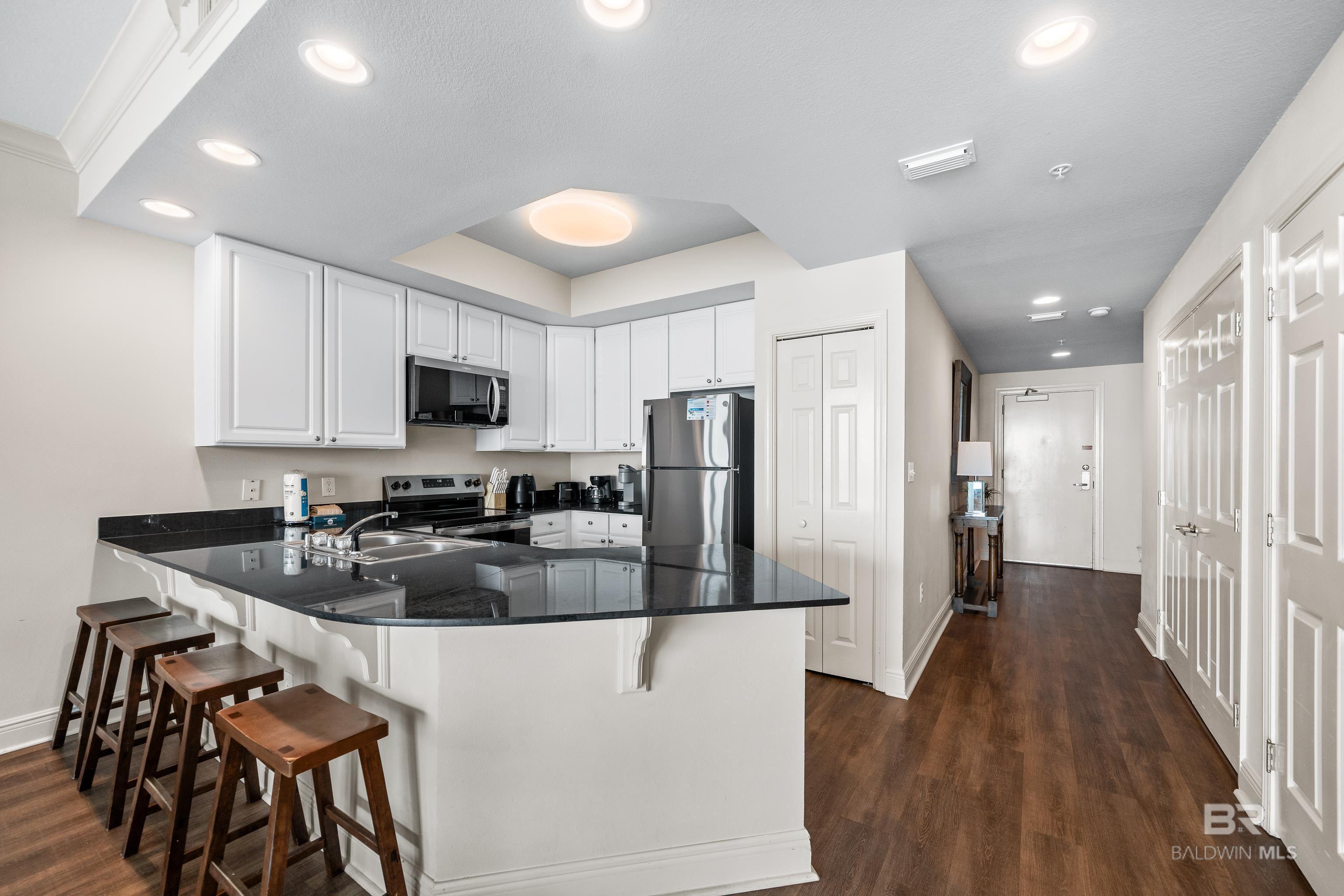 Image 4: Kitchen to Front Door and 2nd Bedroom