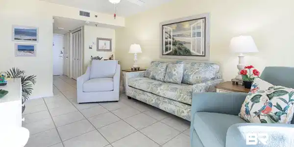Image 3: Living room featuring light tile patterned floors and a ceiling fan