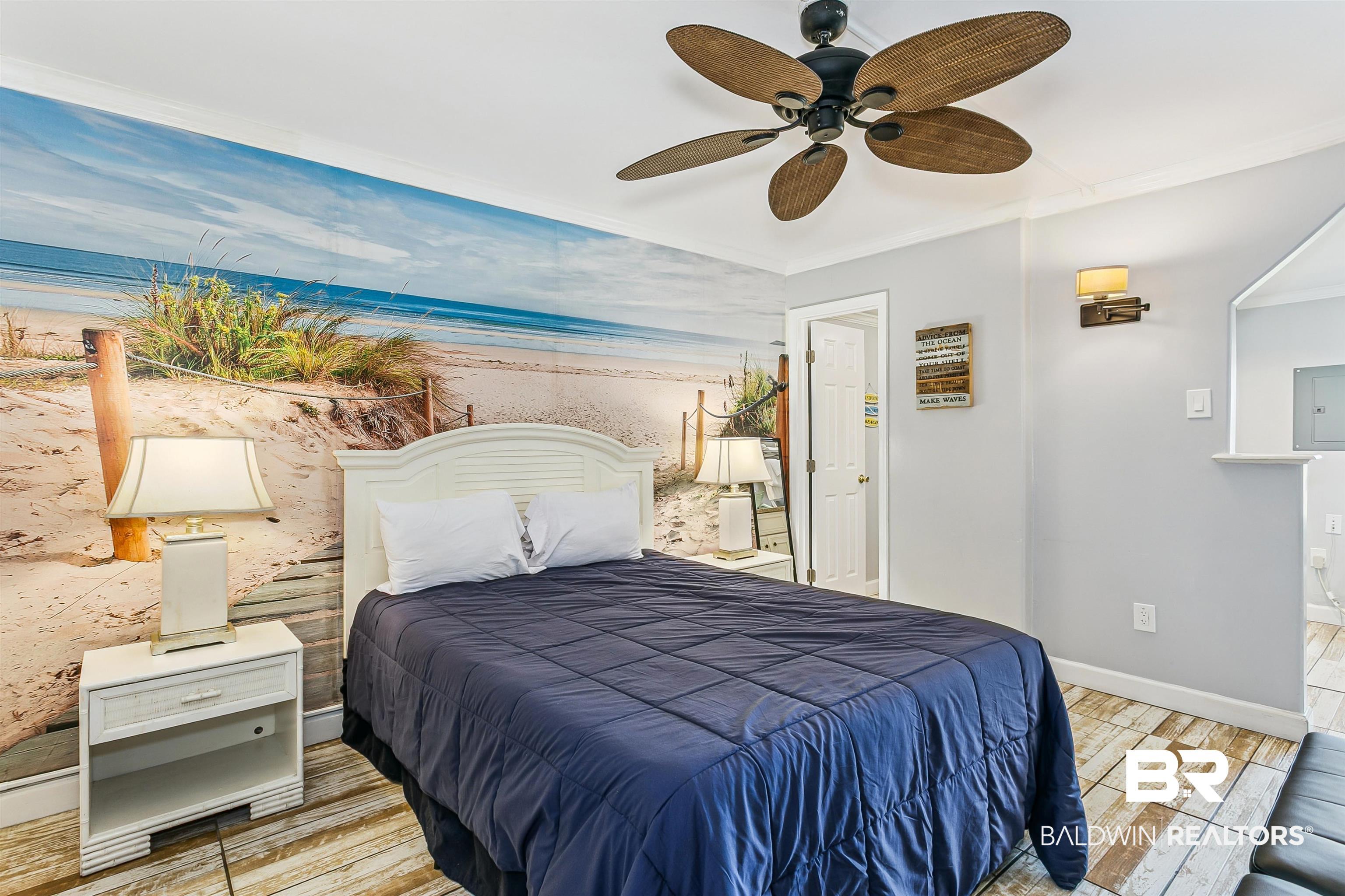 Image 4: Bedroom with electric panel, a ceiling fan, crown molding, and light wood-style floors