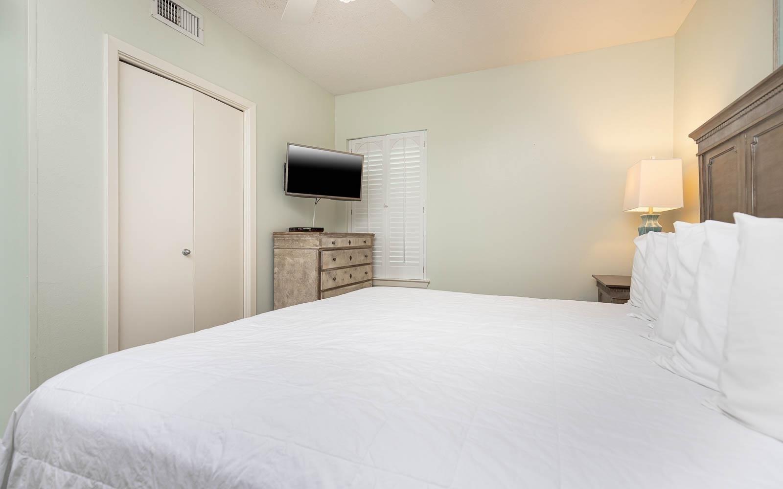 Image 4: Bedroom with visible vents, a closet, and a ceiling fan