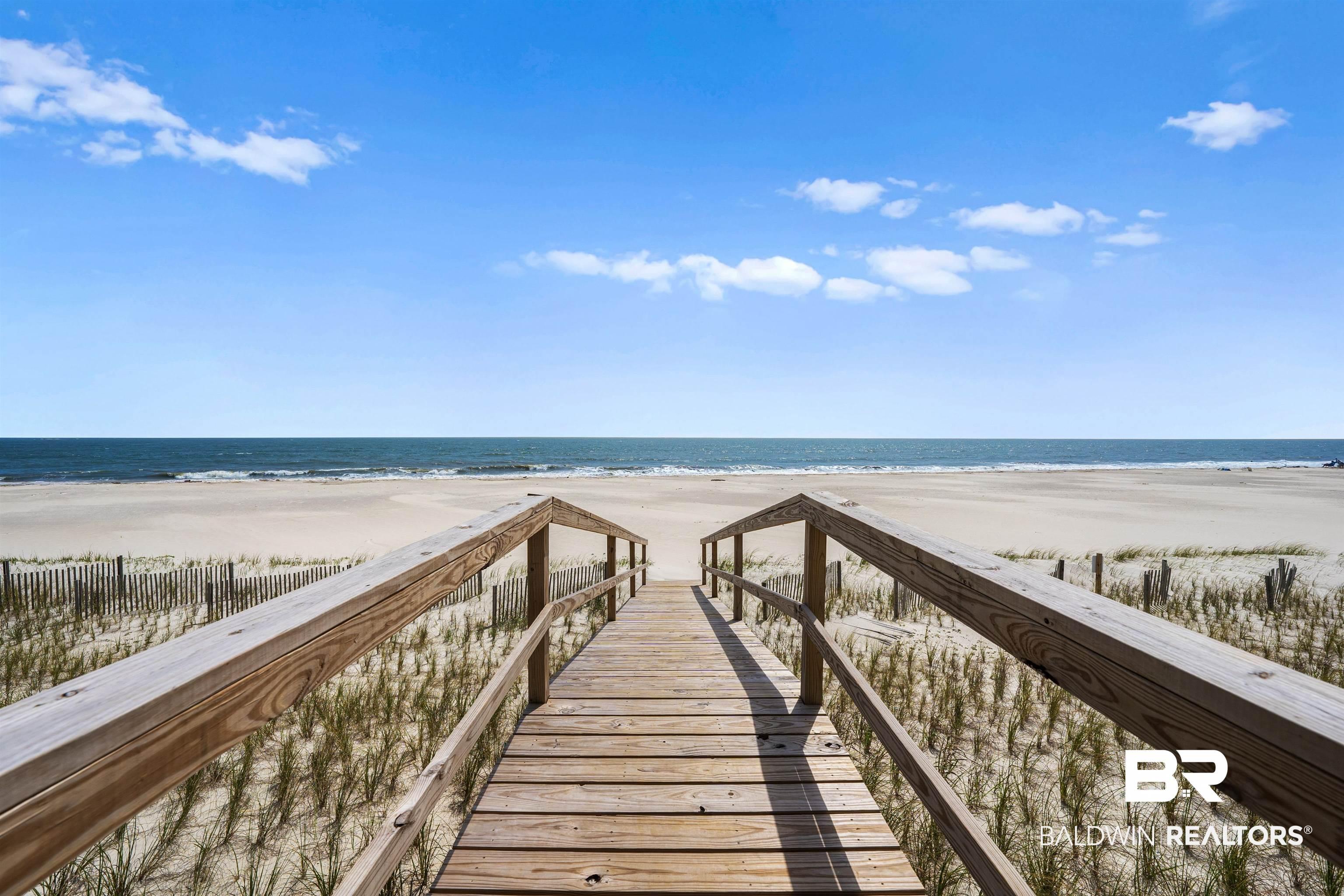Image 3: View of home's community with view of water and beach