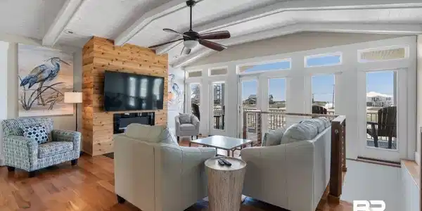Image 4: Living room with ceiling fan, wood finished floors, wooden ceiling, and wooden walls