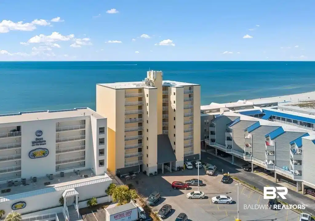 Image 1: Bird's eye view of apartment complex / building and a nearby body of water