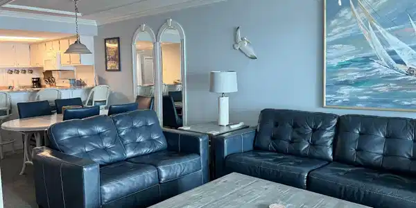 Image 3: Living room with dark colored carpet, crown molding, ceiling fan, and a textured ceiling
