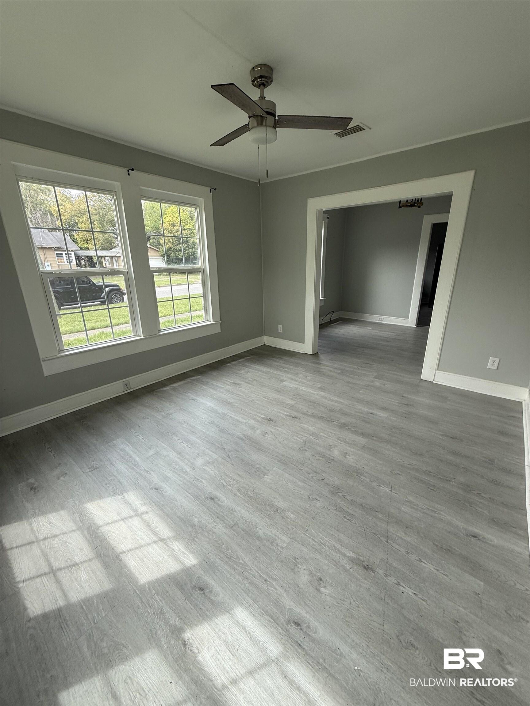 Image 2: Spare room featuring ceiling fan and light wood-type flooring