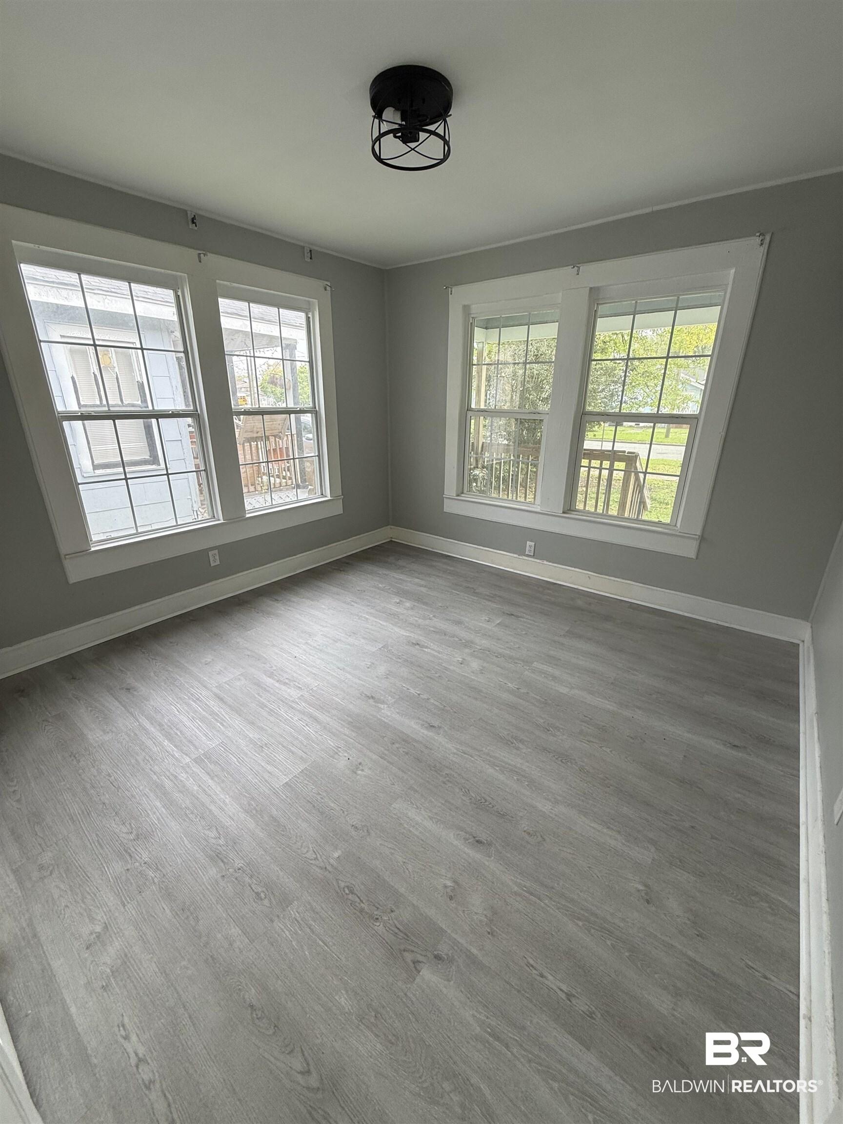 Image 4: Unfurnished room with baseboards and light wood finished floors