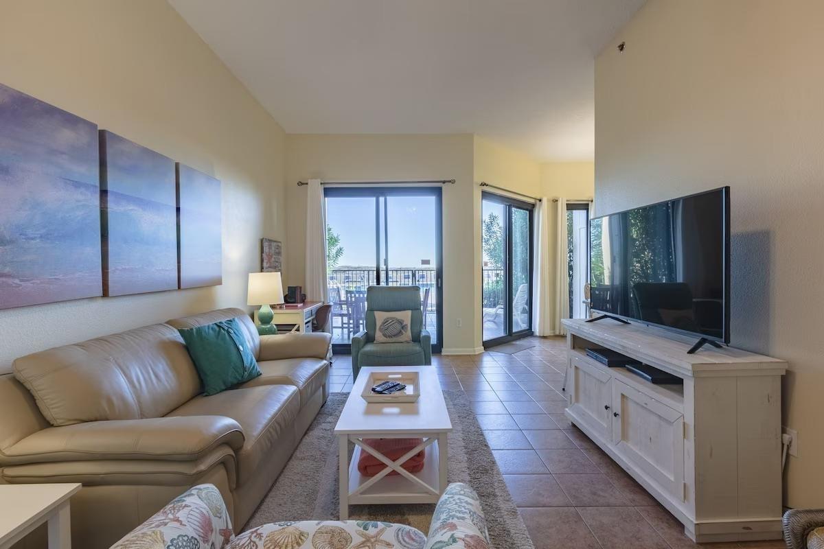 Image 2: Living room featuring tile patterned flooring