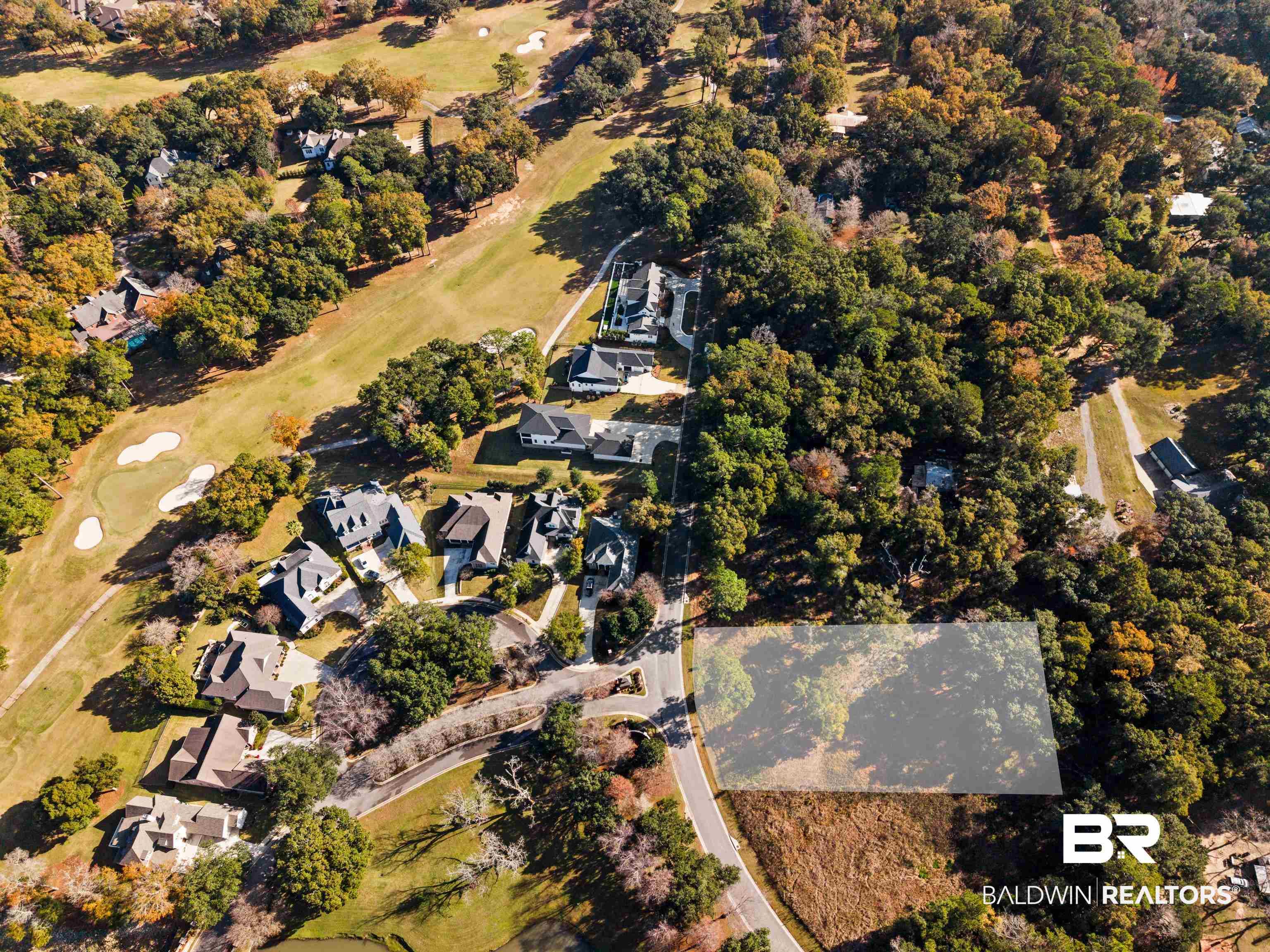 Image 2: View of property location with nearby suburban area and a golf club