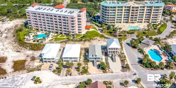 Image 4: Aerial view of a pool area and apartment complex